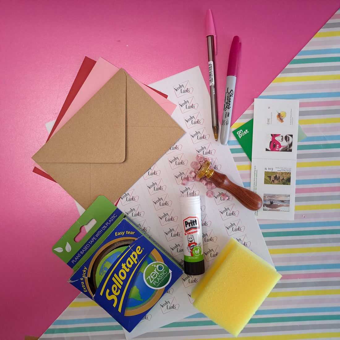 How to seal an envelope without licking it. Wax stamp, sellotape, damp sponge, glue, sticker, and fold in.